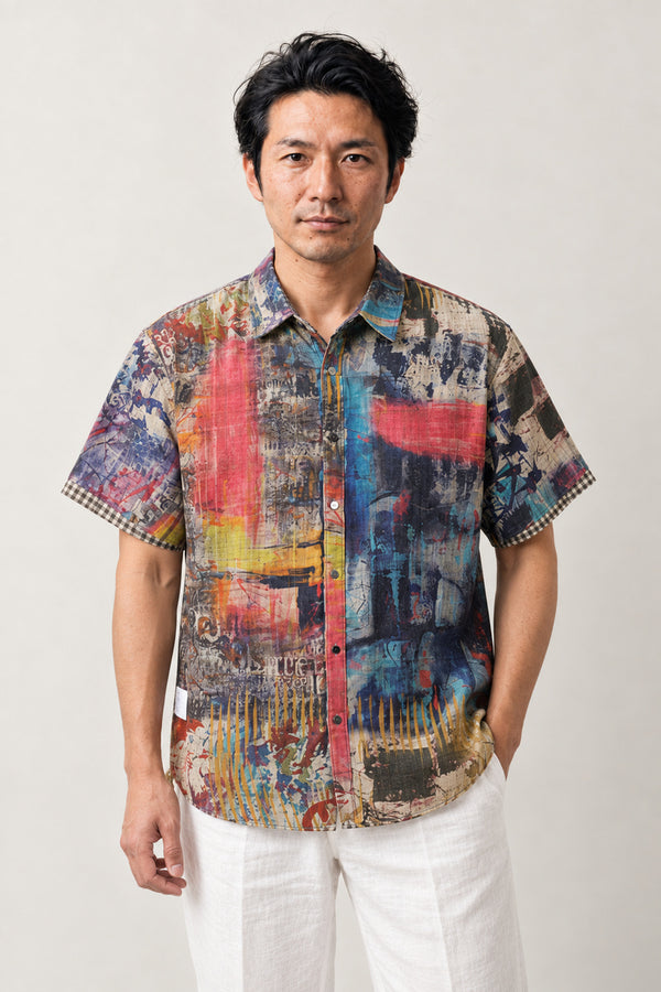 Abstract Paint Print Shirt 'Enogu' – short sleeve shirt with multicolour abstract paint splash print, Japanese streetwear camp collar shirt, front view on model