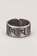 Adjustable Mantra Ring 'Tonae' – wide open sterling silver band ring engraved with Sanskrit seed syllables and sutra text, adjustable Japanese mantra ring, studio view