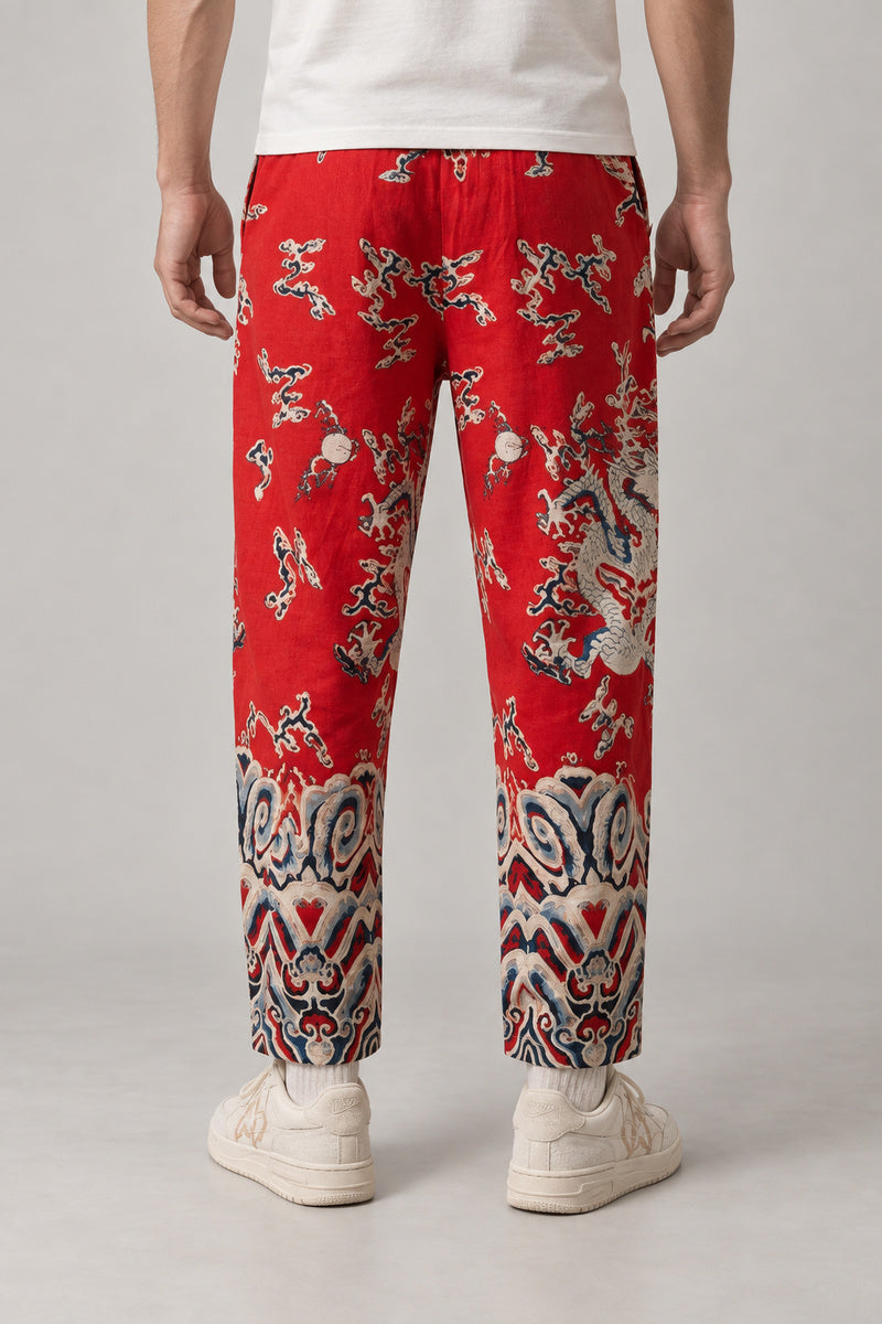 All Over Dragon Print Joggers 'Watatsumi' – red all over dragon print joggers, side view on model