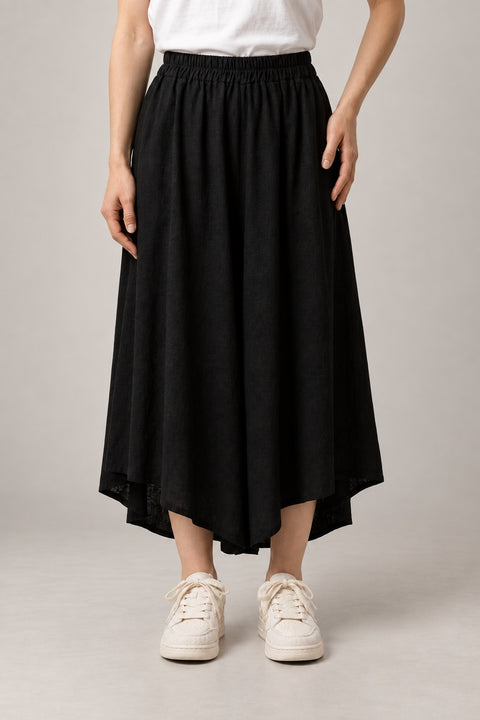 Asymmetric Black Hakama Skirt 'Nurebairo' – black asymmetric hem hakama skirt with elastic waist, women's Japanese style midi skirt, front view on model