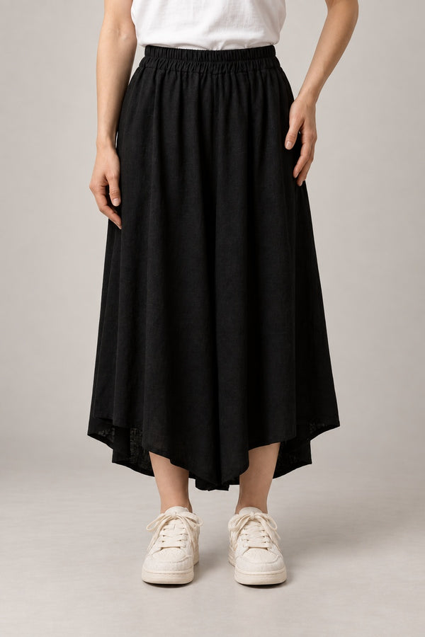 Asymmetric Black Hakama Skirt 'Nurebairo' – black asymmetric hem hakama skirt with elastic waist, women's Japanese style midi skirt, front view on model