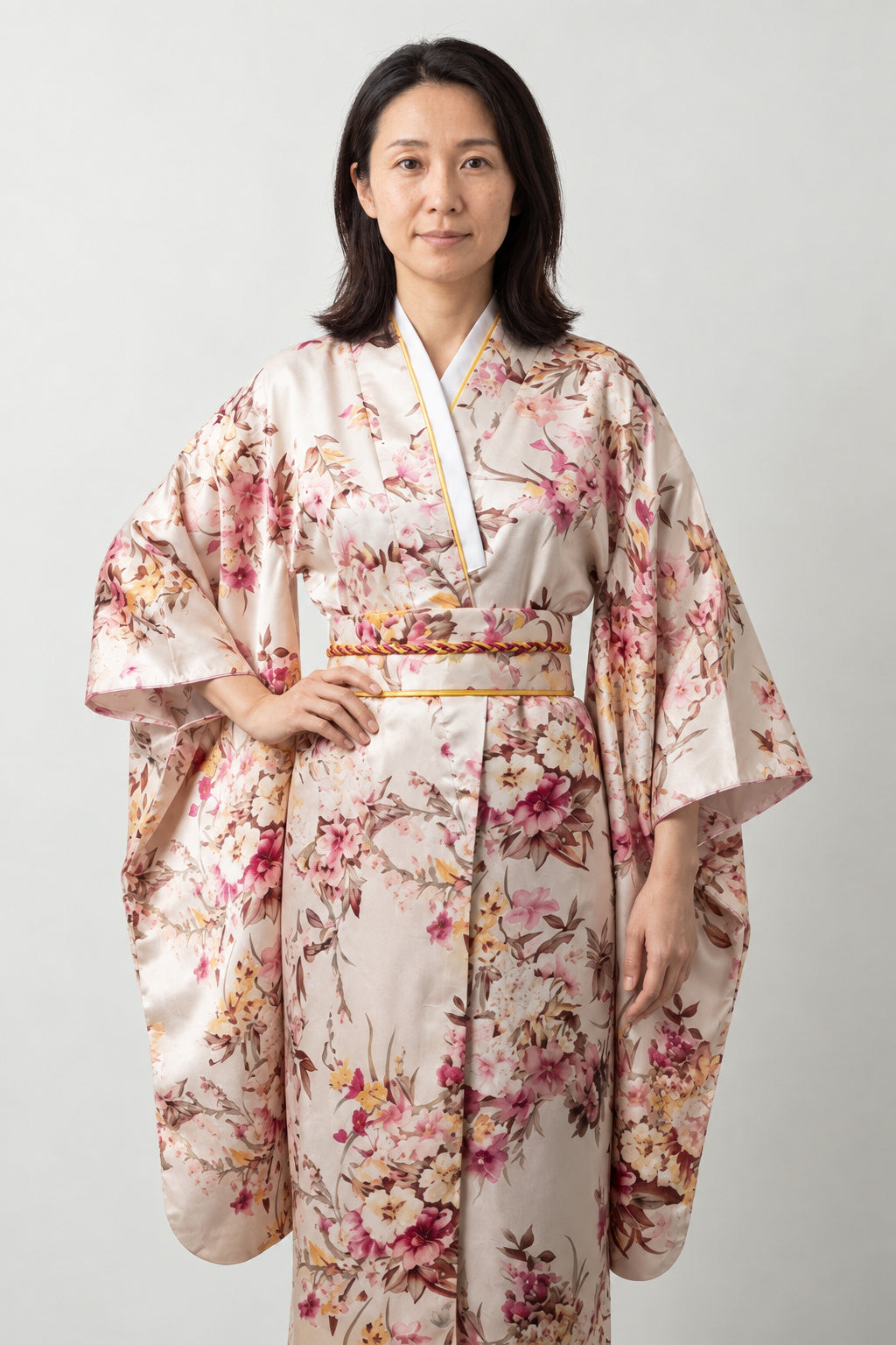 Beige Cherry Blossom Kimono 'Hanafubuki' – beige and pink women's kimono robe with cherry blossom and peacock print and obi sash, long Japanese kimono, front view on model