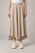 Beige Midi Hakama Skirt 'Torinoko' – beige midi hakama skirt with elastic waist and asymmetric hem, women's Japanese linen-look skirt, front view on model