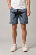 Big Star Patchwork Denim Shorts 'Hoshigata' – light blue washed denim shorts with a large black star patch, Japanese streetwear shorts, front view on model