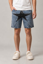 Big Star Patchwork Denim Shorts 'Hoshigata' – light blue washed denim shorts with a large black star patch, Japanese streetwear shorts, front view on model
