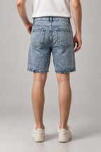 Big Star Patchwork Denim Shorts 'Hoshigata' – back view of the light blue washed denim shorts, on model