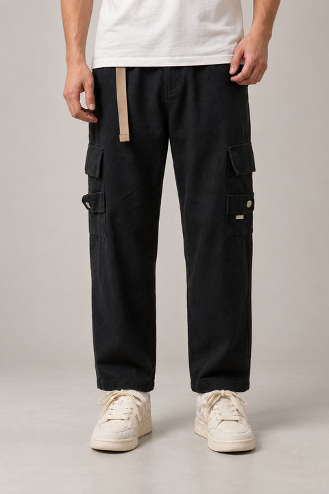 Black Belted Cargo Pants 'Kakugo' – black cargo pants with side pockets and beige belt strap, Japanese streetwear trousers, front view on model