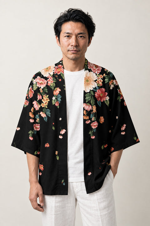 Black Floral Casual Haori 'Chirihana' – black casual haori jacket with pink and green floral print at the hem and shoulders, unisex Japanese kimono cardigan, front view on model