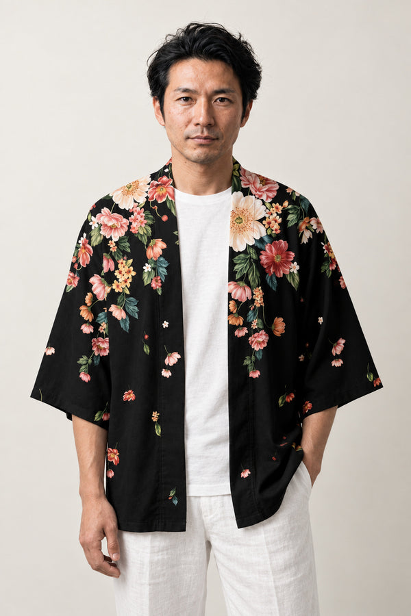 Black Floral Casual Haori 'Chirihana' – black casual haori jacket with pink and green floral print at the hem and shoulders, unisex Japanese kimono cardigan, front view on model