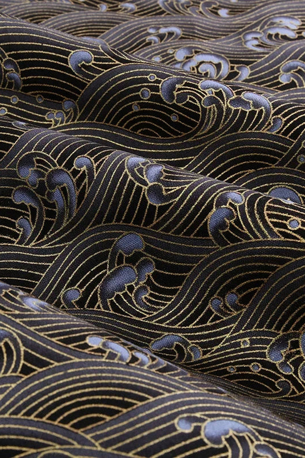 Black Gold Wave Wrapping Cloth 'Kinnami' – black furoshiki printed with waves in fine gold lines and blue-grey foam, Japanese furoshiki wrapping cloth 50 by 145 cm, close-up of the print