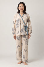 Blue Butterfly Two-Piece Pajamas 'Chouka' – cream women's two-piece pyjamas with blue butterfly print and side-tie top, Japanese style loungewear, front view on model