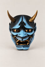 Blue Hannya Mask 'Namanari' – pale blue painted resin hannya mask with gold horns, eyes and teeth, Japanese Noh demon mask, studio view