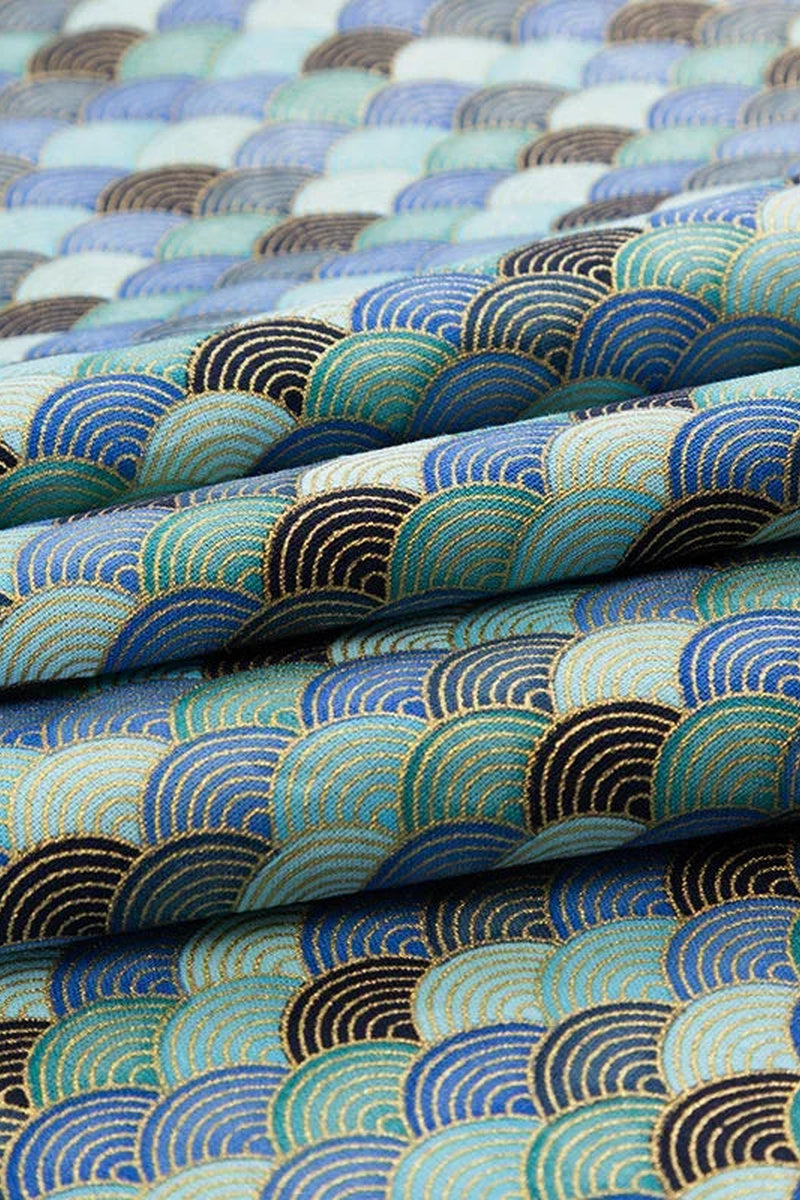 Blue Seigaiha Japanese Furoshiki 'Seinami' – furoshiki printed with seigaiha wave pattern in blues and teal outlined in gold, Japanese furoshiki wrapping cloth 50 by 145 cm, close-up of the print