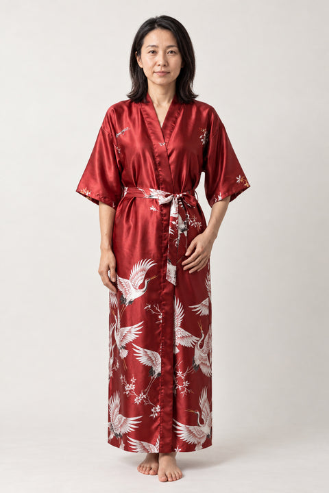 Bordeaux Maxi Kimono 'Tsurubeni' – bordeaux red women's long satin-look kimono robe with white crane print and tie belt, Japanese maxi robe, front view on model