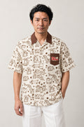 Cartoon Animal Doodle Shirt 'Rakugaki' – cream short sleeve shirt with brown cartoon animal doodle print and chest pocket, Japanese streetwear camp collar shirt, front view on model