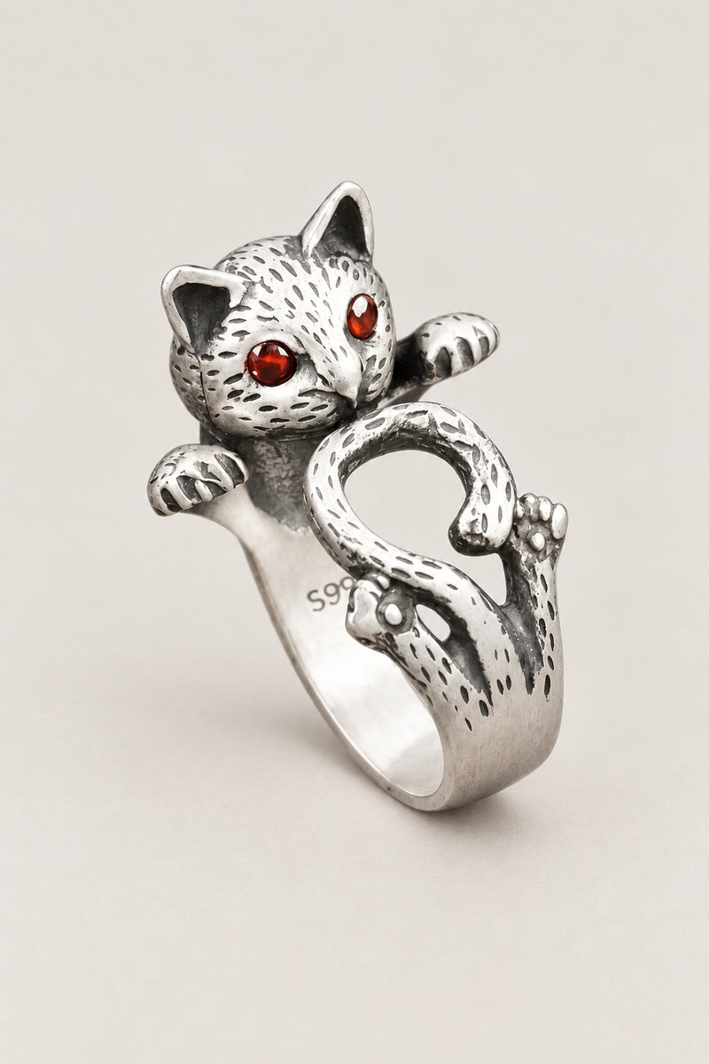 Cat Wrap Ring 'Nemuri' – sterling silver cat ring wrapping round the finger with curled tail and red stone eyes, adjustable Japanese cat ring, studio view