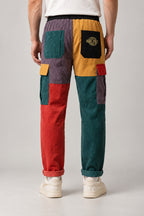 Colour Block Patchwork Trousers 'Tsugiki' – back view of the colour block patchwork trousers showing yellow and red panels