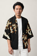 Crane and Red Sun Haori Jacket 'Chitose' – black haori jacket with white cranes, cherry blossom and red sun print, unisex Japanese kimono style cardigan, front view on model