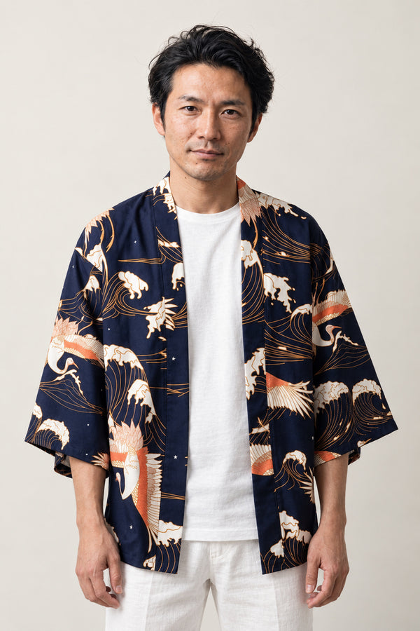 Crane and Wave Haori Half Coat 'Shiosai' – navy Japanese haori jacket with white crane and wave print, unisex kimono style half coat, front view on model