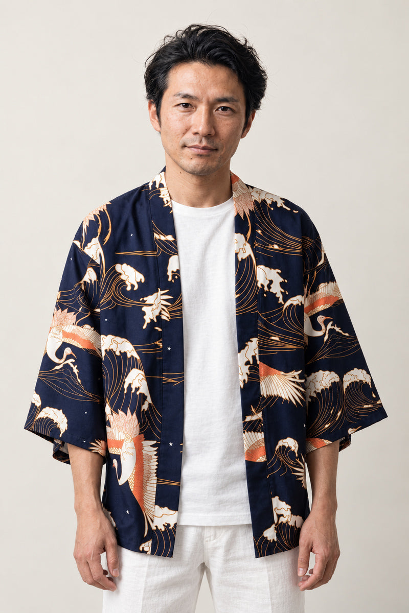 Crane and Wave Haori Half Coat 'Shiosai' – navy Japanese haori jacket with white crane and wave print, unisex kimono style half coat, front view on model