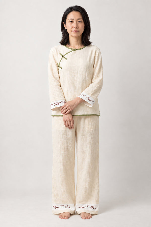 Cream Japanese Style Pajamas 'Yutori' – cream women's Japanese style pyjama set with knot buttons, loungewear top and trousers, front view on model