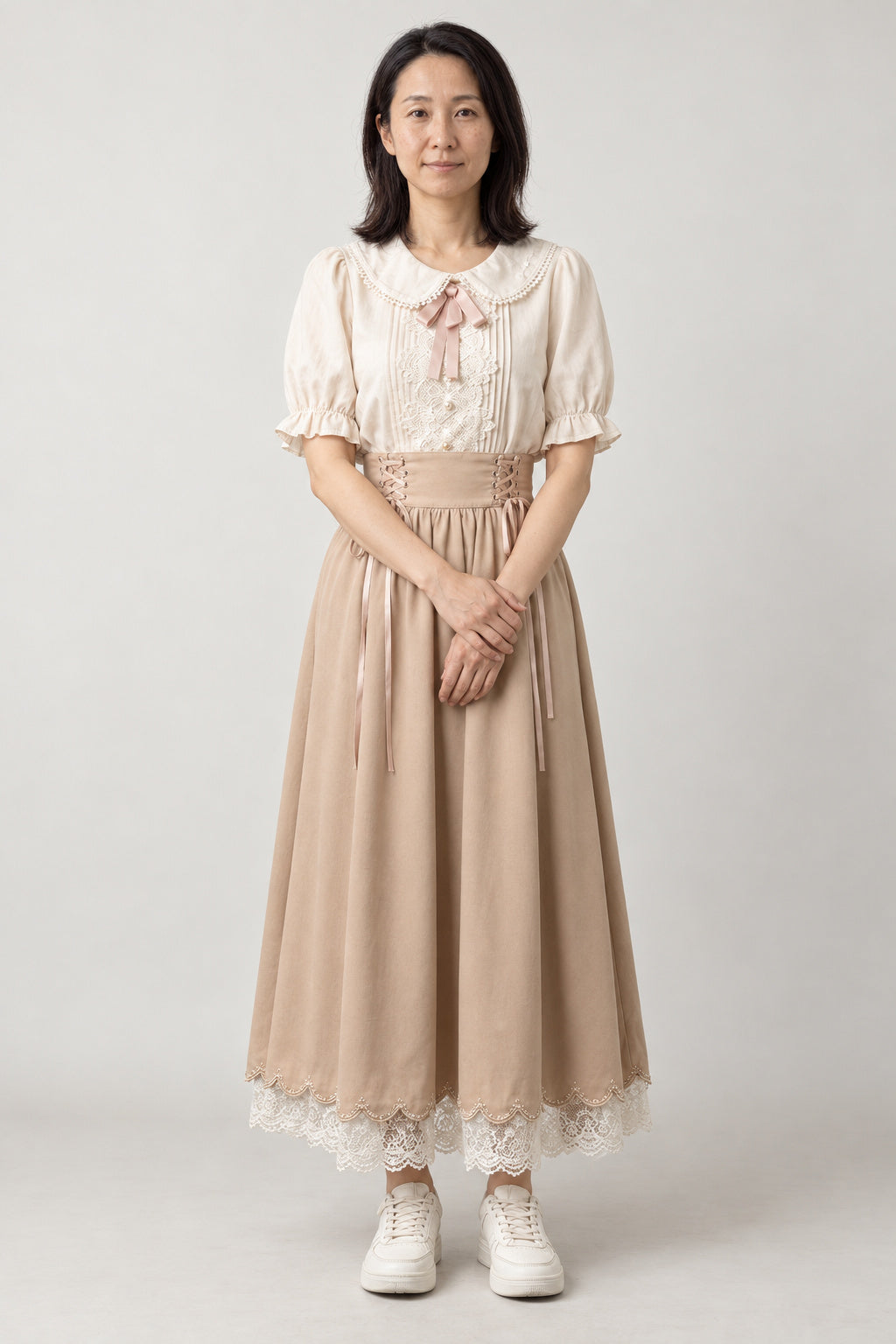 Cream Pussy Bow Dress Set 'Zouge' – cream pussy bow blouse and beige lace-up midi skirt with lace hem, Japanese style two-piece dress set, front view on model
