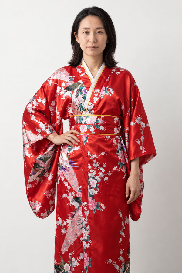Crimson Peacock Long Kimono 'Shinku' – crimson red women's long kimono robe with peacock and cherry blossom print and obi sash, Japanese satin-look kimono dress, front view on model