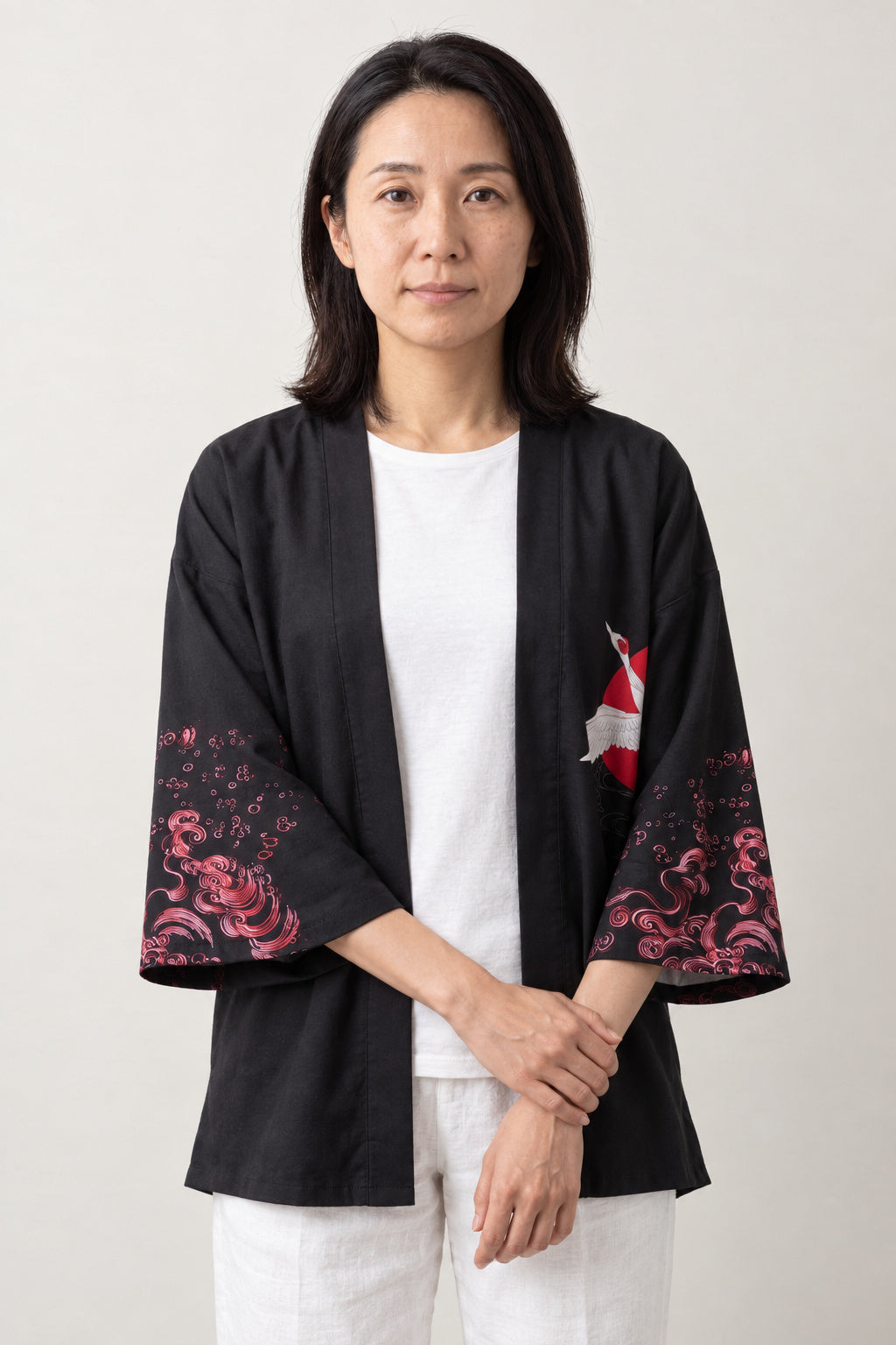 Crimson Peony Kimono Jacket 'Enji' – black women's kimono jacket with crimson peony and white crane print, Japanese haori style cardigan, front view on model