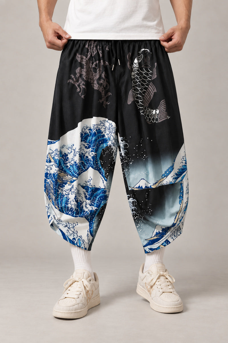 Cropped Japanese Print Pants 'Jukkei' – black cropped pants with great wave and koi print, front view on model