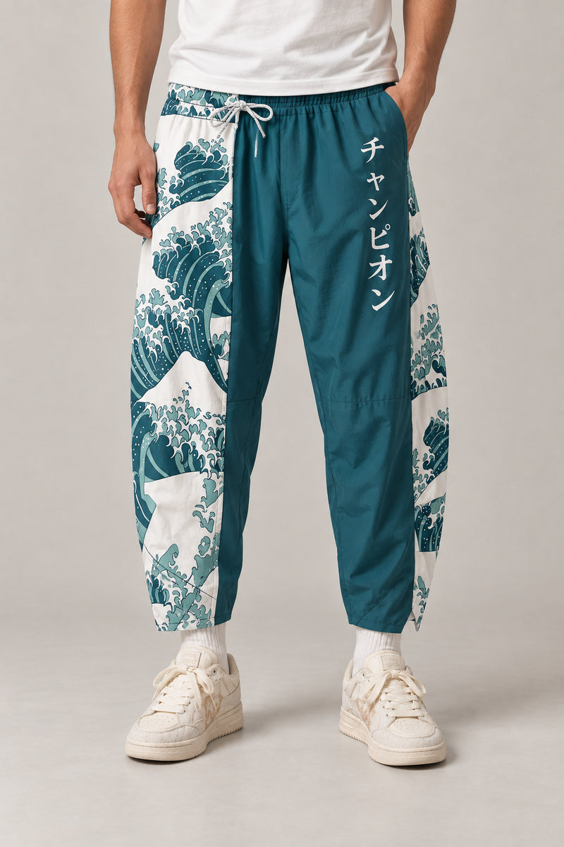 Cropped Japanese Print Pants 'Jukkei' – teal cropped pants with great wave print, front view on model