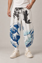 Cropped Japanese Print Pants 'Jukkei' – white cropped pants with great wave and koi carp, front view on model