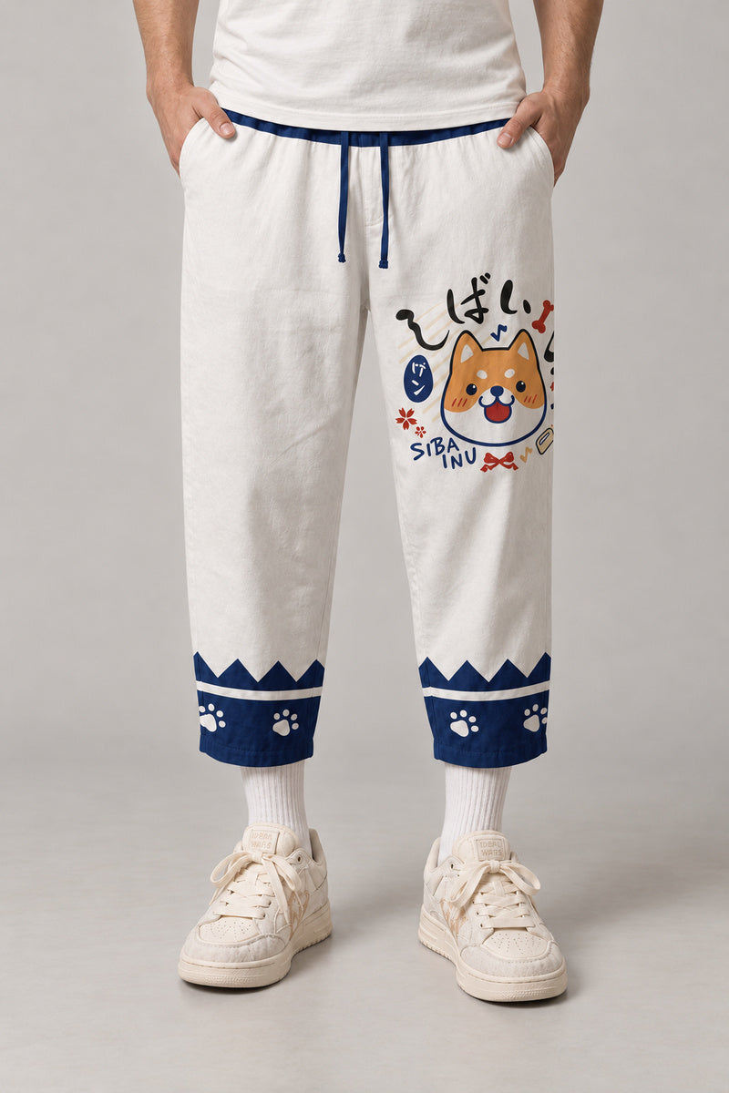 Cropped Japanese Print Pants 'Jukkei' – white cropped pants with shiba inu print, side view on model