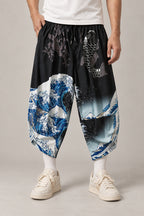 Cropped Japanese Print Pants 'Jukkei' – black cropped pants with great wave and koi, front view on model
