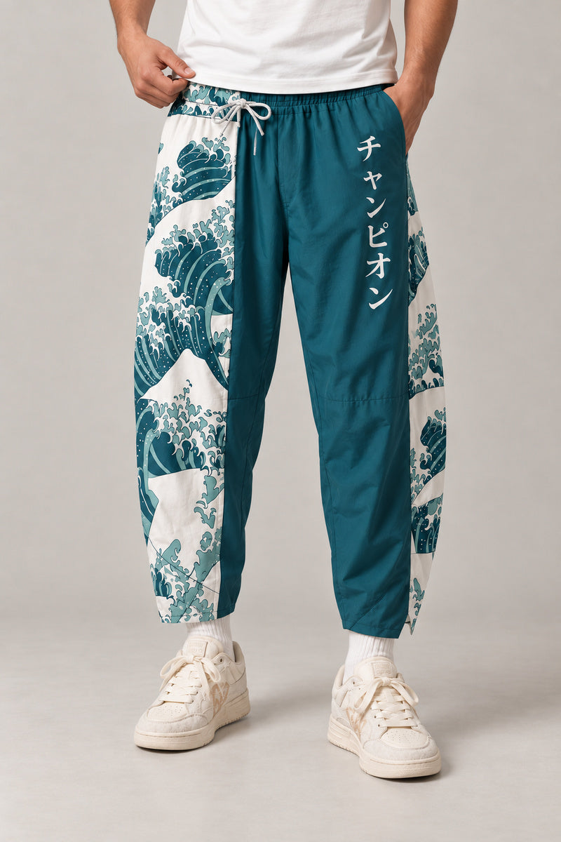 Cropped Japanese Print Pants 'Jukkei' – teal cropped pants with great wave print and Japanese lettering, front view on model