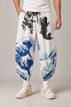 Cropped Japanese Print Pants 'Jukkei' – white cropped pants with great wave and koi carp print, front view on model