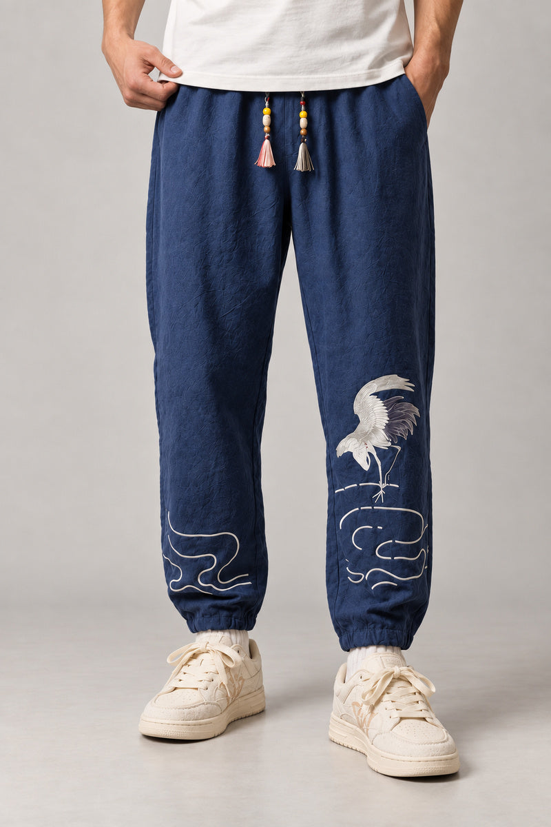 Dancing Crane Jogger Pants 'Sennen' – navy version of the dancing crane joggers, front view on model