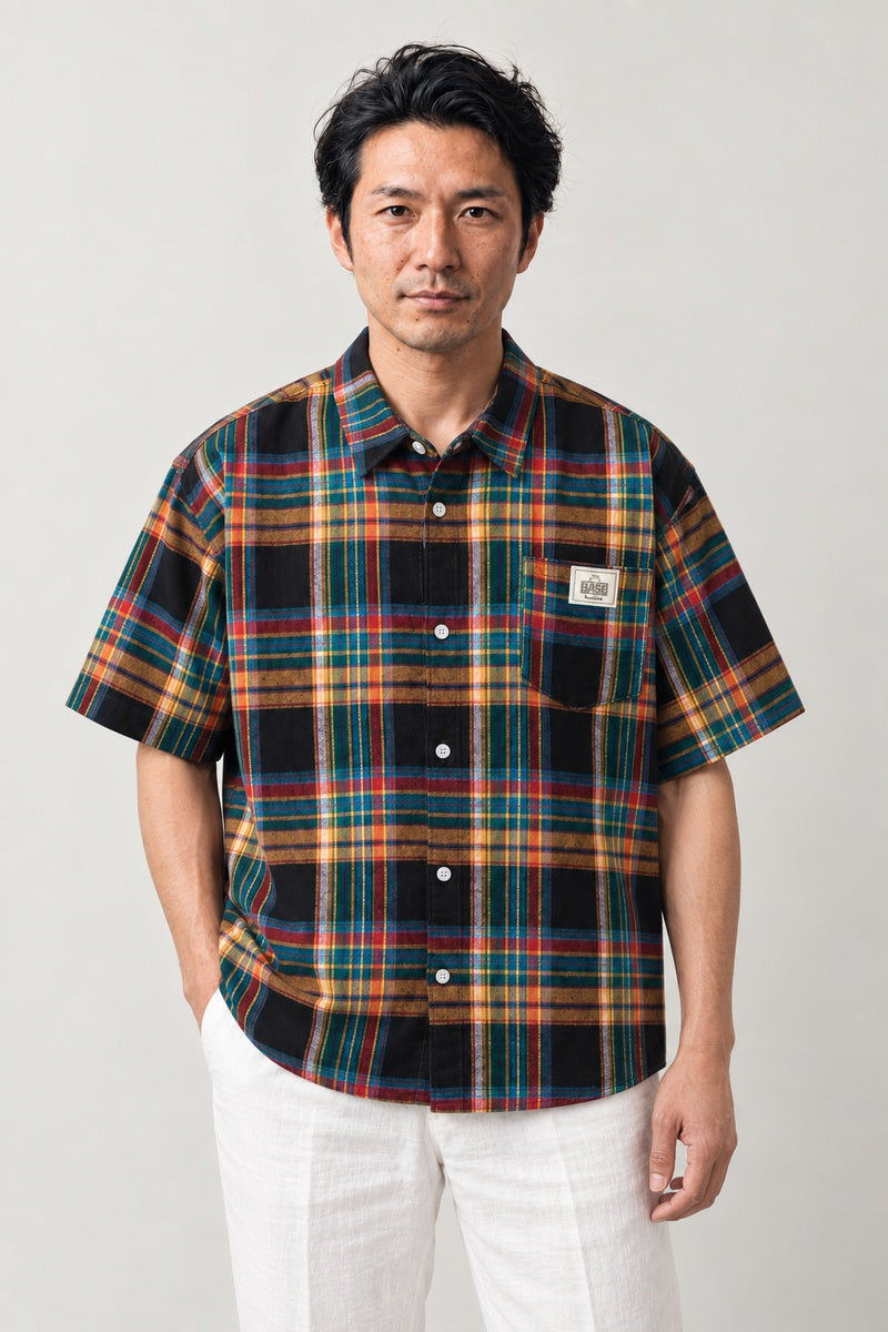 Dark Tartan Plaid Shirt 'Koshi' – navy, red and green tartan plaid short sleeve shirt with chest pocket, Japanese streetwear check shirt, front view on model