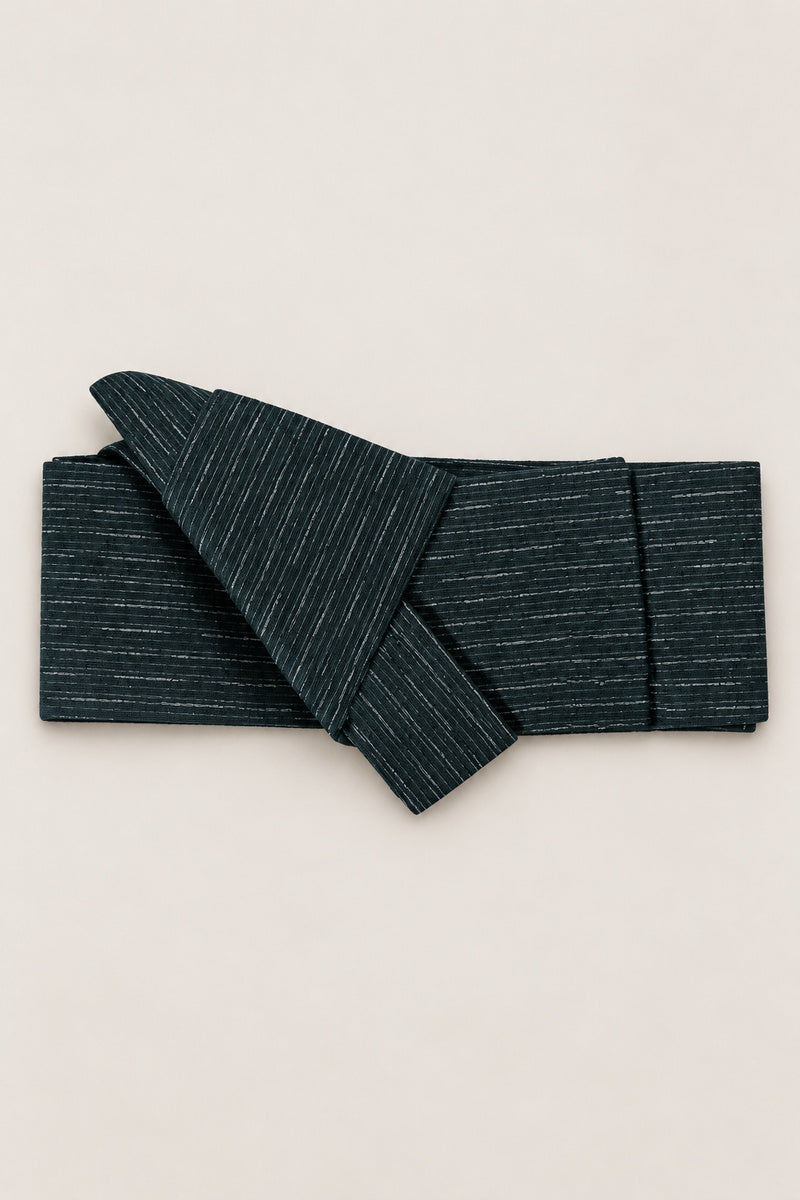 Dark Teal Obi Belt 'Tetsunando' – dark teal obi belt with fine white flecks, narrow pre-tied Japanese obi belt with sewn knot and hidden adjustable closure, for kimono, yukata or jinbei, studio view