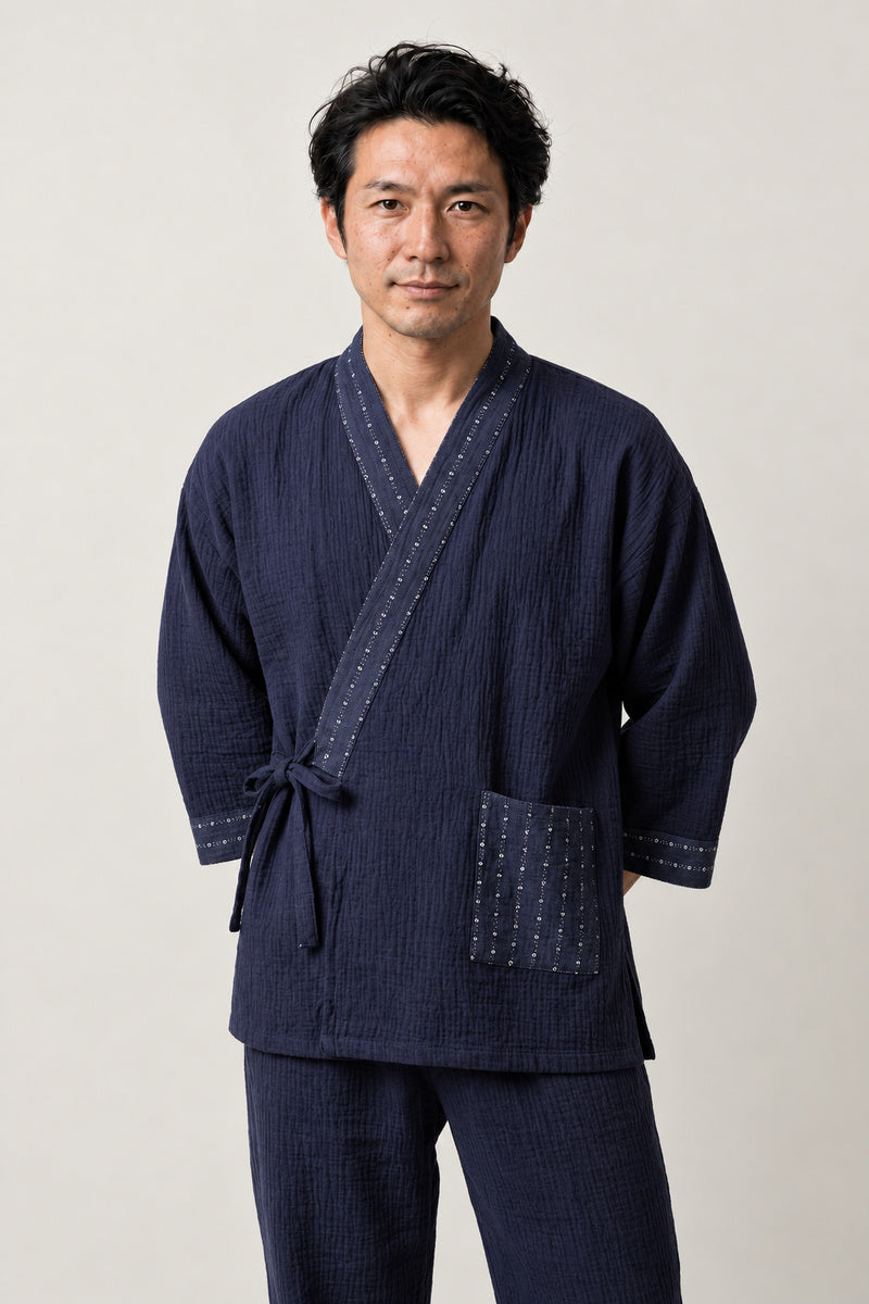 Dot Trim Kimono Pajamas 'Mameshibori' – navy jinbei pyjamas with dotted shibori print trim and pocket, unisex two-piece Japanese jinbei set with side-tie top and shorts, front view on model