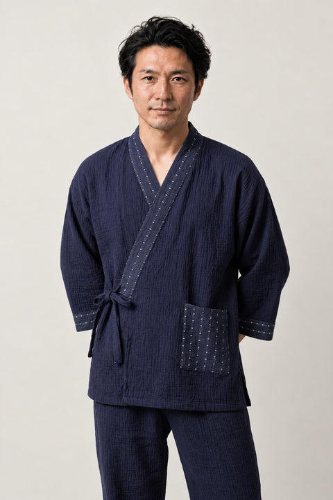 Dot Trim Kimono Pajamas 'Mameshibori' – navy jinbei pyjamas with dotted shibori print trim and pocket, unisex two-piece Japanese jinbei set with side-tie top and shorts, front view on model
