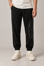 Dragon Panel Wide Leg Pants 'Tatsunami' – black dragon panel wide leg pants, side view on model