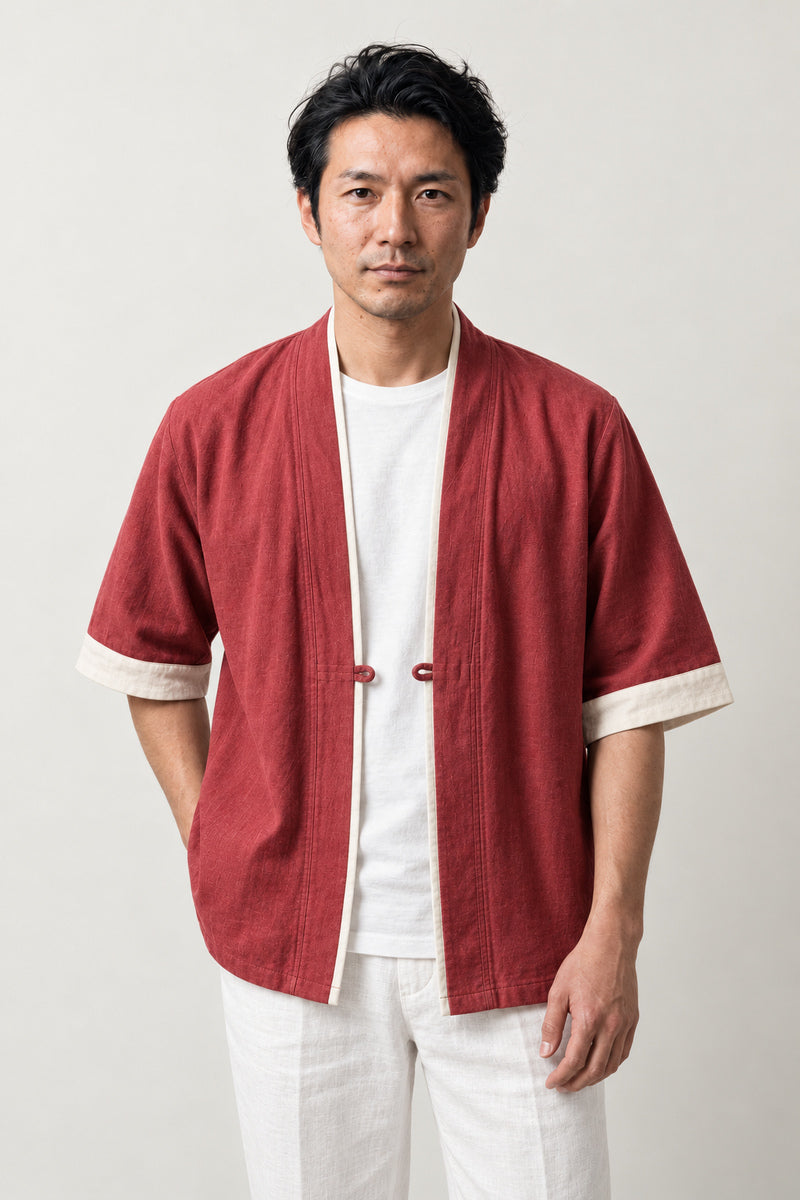 Faded Vermilion Kimono Jacket 'Shuiro' – faded vermilion red Japanese kimono jacket with cream trim and toggle, unisex noragi haori style cardigan, front view on model