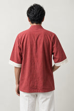 Faded Vermilion Kimono Jacket 'Shuiro' – back view of washed red kimono jacket with cream trim