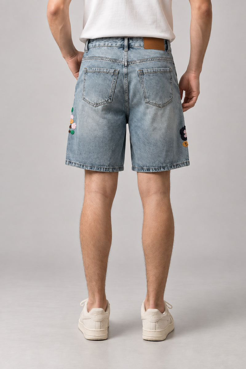 Flower Embroidered Denim Shorts 'Nohana' – back view of the light blue denim shorts, on model