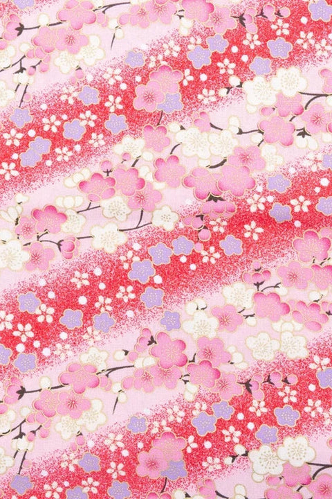 Flowing Sakura Furoshiki Wrap 'Sakuragawa' – pink furoshiki printed with cherry blossom in diagonal bands of deep rose, Japanese furoshiki wrapping cloth 50 by 145 cm, close-up of the print