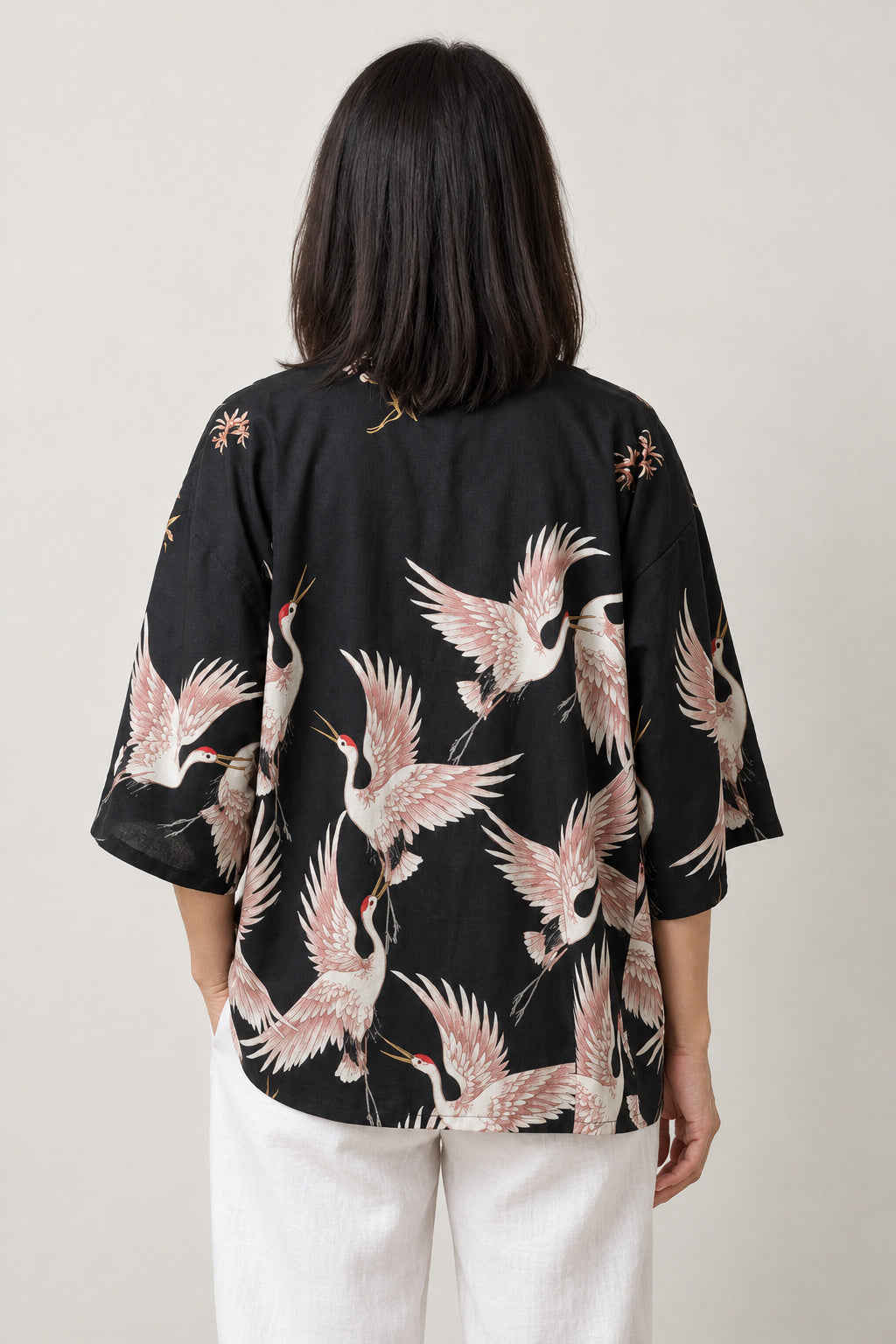 Flying Crane Kimono Jacket 'Usubeni' – back view of black kimono jacket with all-over pink flying cranes print