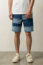 Frayed Seam Patchwork Shorts 'Hotsure' – blue patchwork denim shorts with frayed seams in three washes, front view on model, studio