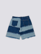 Frayed Seam Patchwork Shorts 'Hotsure' – flat lay back view of the blue patchwork denim shorts