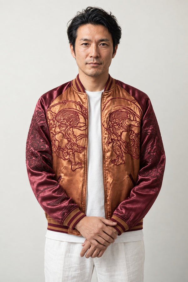 Fujin and Raijin Sukajan 'Furai' – burgundy and orange sukajan with embroidered Fujin wind god and Raijin thunder god, Japanese sukajan souvenir bomber jacket, front view on model