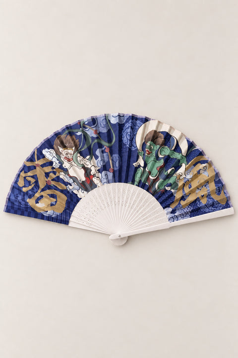 Fujin Raijin Folding Fan 'Kaminari' – folding fan printed with Fujin wind god and Raijin thunder god on navy clouds with gold kanji, Japanese folding sensu fan with bamboo ribs, open, studio view